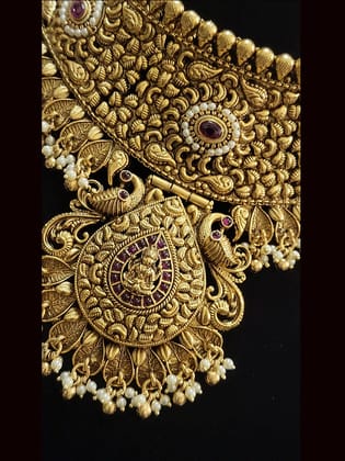 Laxmiji motif in leaf design center with peacock sides broad choker set with intricate paisley work-Ruby pearl