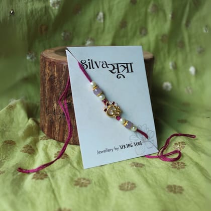 OM beaded rakhi in purple