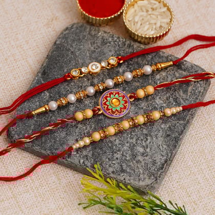 Pack of 4 Designer Pearl Rakhis and Roli Chawal Pack