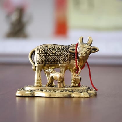 Dreamkraft Kamdhenu Cow with Calf Idol | Golden Metal Handicraft Showpiece for Home Decor, Mandir, Pooja Room, Gift Article for Vastu, Office Table, Diwali, Housewarming & Anniversary