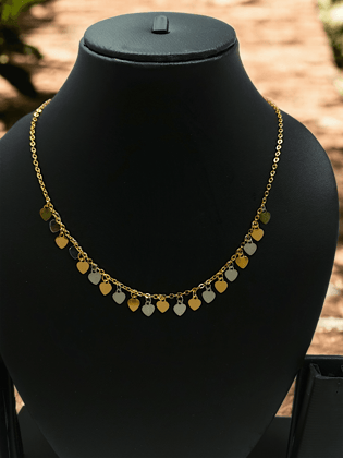 Gold Necklace Featuring a Heart Charm