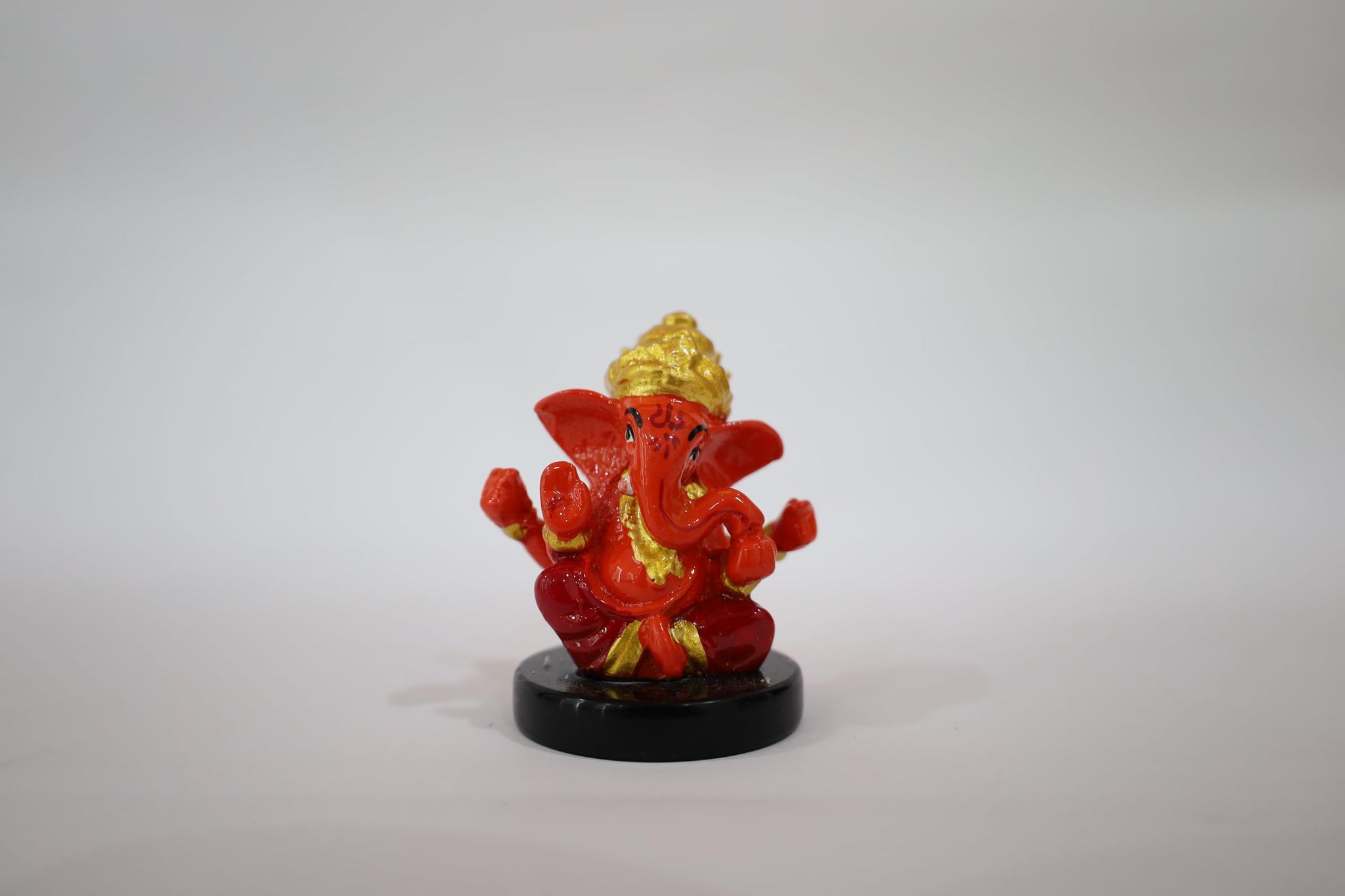 Red and Gold Ganesha Decorative Statue with Black Base, Hindu Deity Figurine, Handcrafted Religious Art Piece