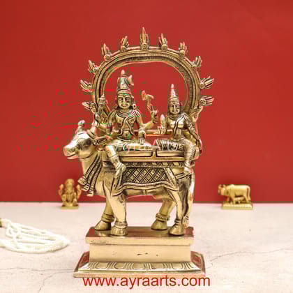 Handmade Shiva Parvati Seated on Nandi Pradosh Nayagar with Prabhavali Idol - 9 inch Height Handmade Shiva Parvati Seated on Nandi Pradosh Nayagar with Prabhavali Idol - 9 inch Height