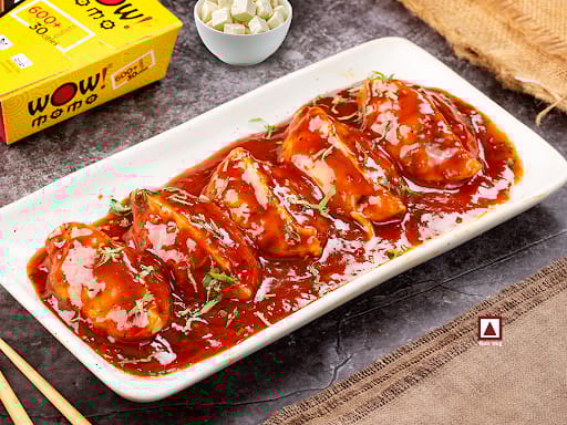 Chicken Cheese Pan Fried Momo In Schezwan Sauce (Spicy)