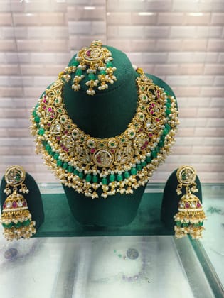 Saniya Exquisite Gold Plated Kundan and Pearl Bridal Jewelry Set with Emerald Green Drops