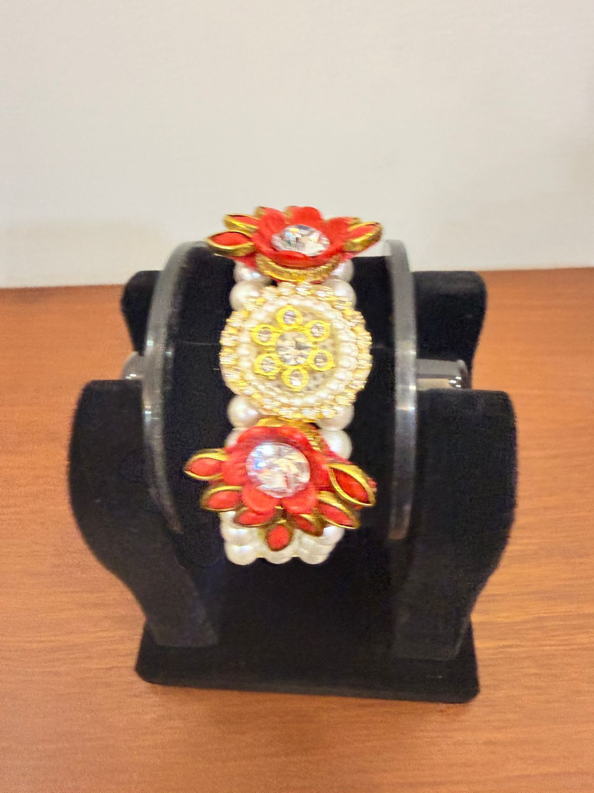 vibrant red floral moti pearl bracelet centered with shiny crystal stones