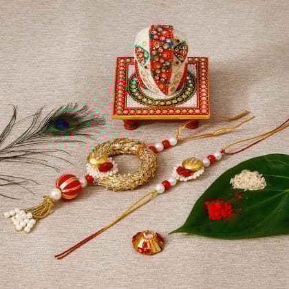 Designer Bhaiya Bhabhi Rakhi with Lord Ganesha on Kundan Studded Marble Chowki and Roli Tikka Matki