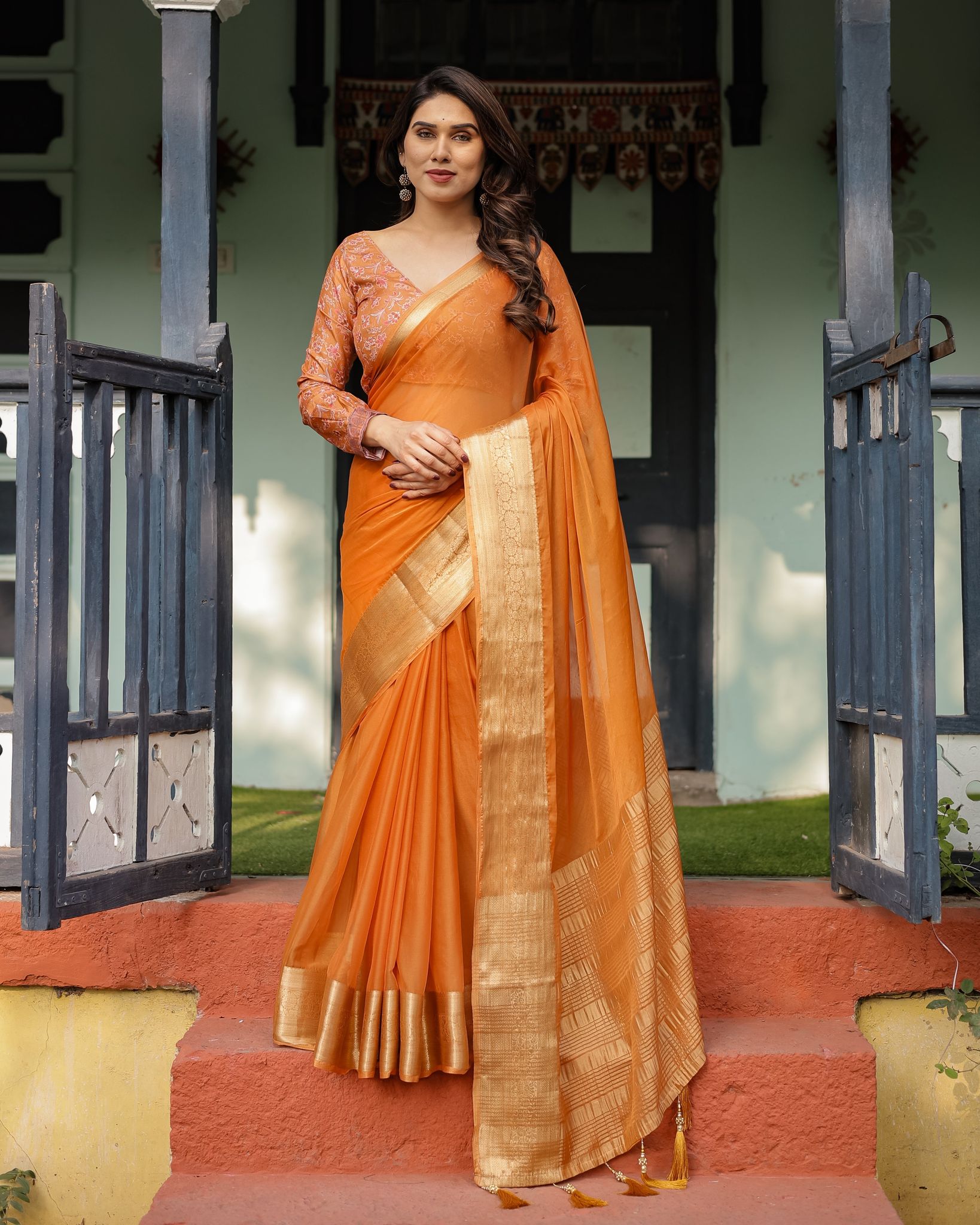 Sunset Orange Plain Chiffon Saree with Gold Zari Border, Floral Embroidered Blouse & Tassel Detailing-Regular