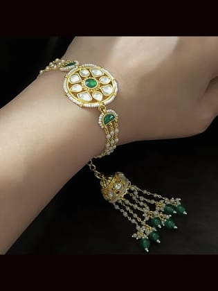Coloured stone in the center of round paachi kundan bhabhi or sister rakhi with jhoomki tassel-Green
