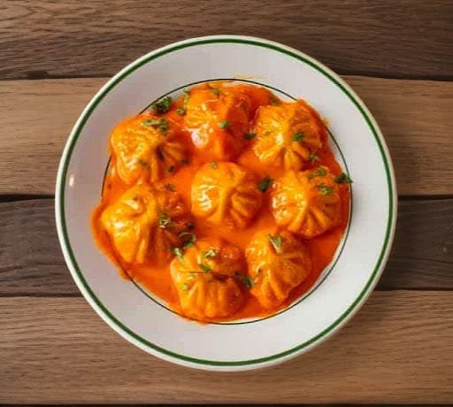 Paneer Achari Gravy Momos