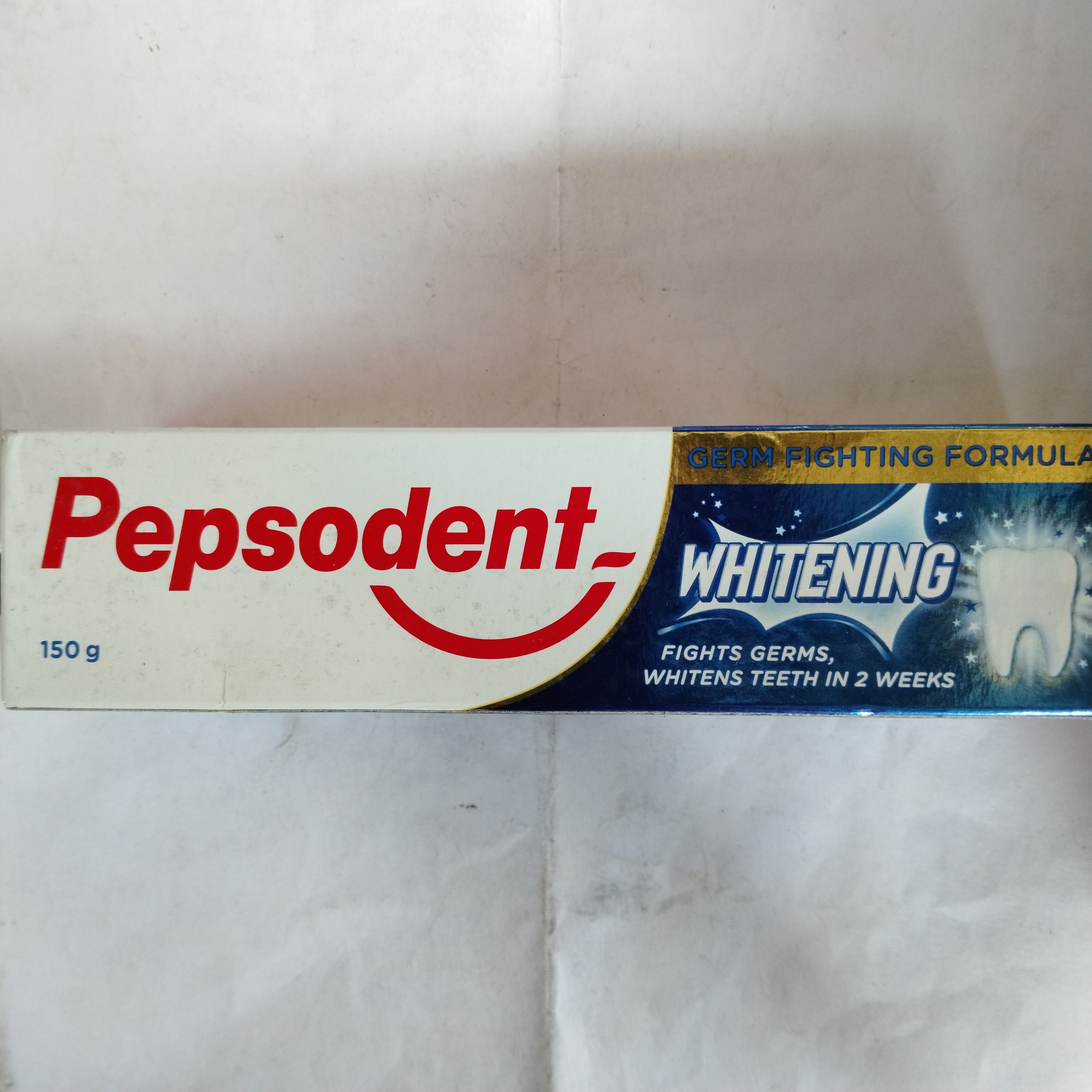 Pepsodent whitening Fights germs, Whitens teeth in 2 weeks 