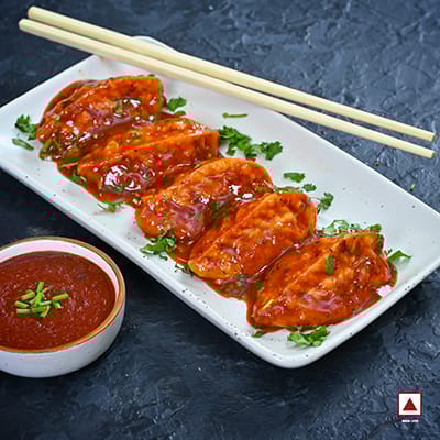 Chicken Pahari Fresh Pan Fried Momo In Schezwan Sauce(Spicy)