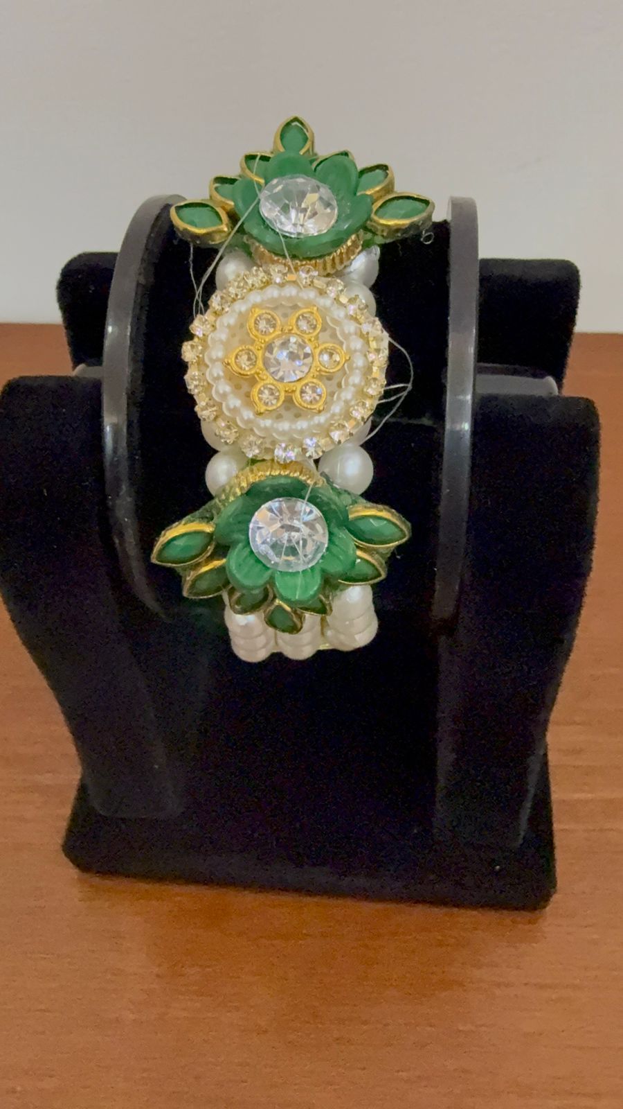 An Elegant Green And Golden Lotus-themed Moti Pearl Bracelet Centered With Sparkling Crystals