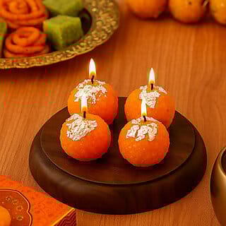 Pack of 4 Motichoor laddu candles Candle(Orange, Pack of 4)