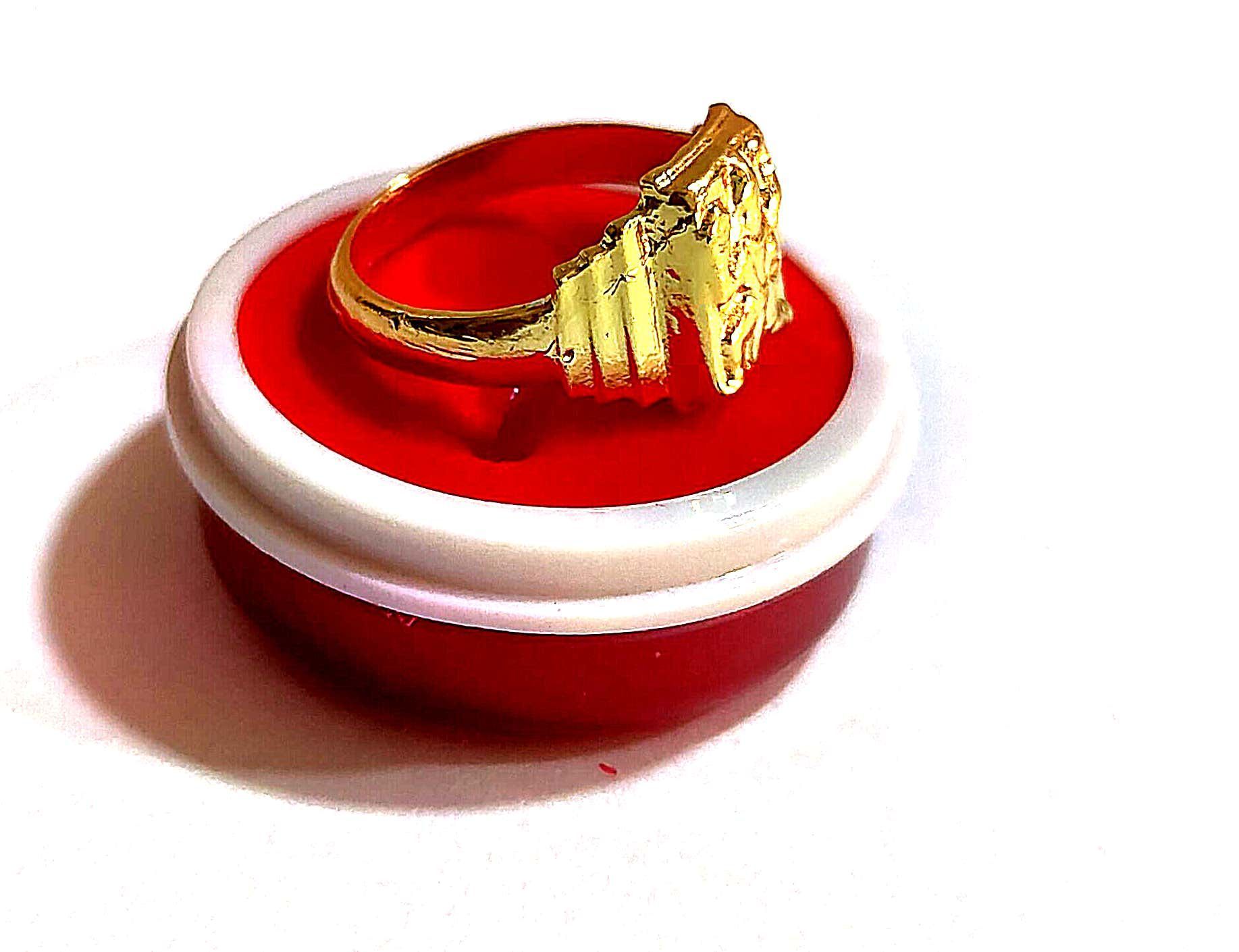 "Golden Ring with Intricate Design"