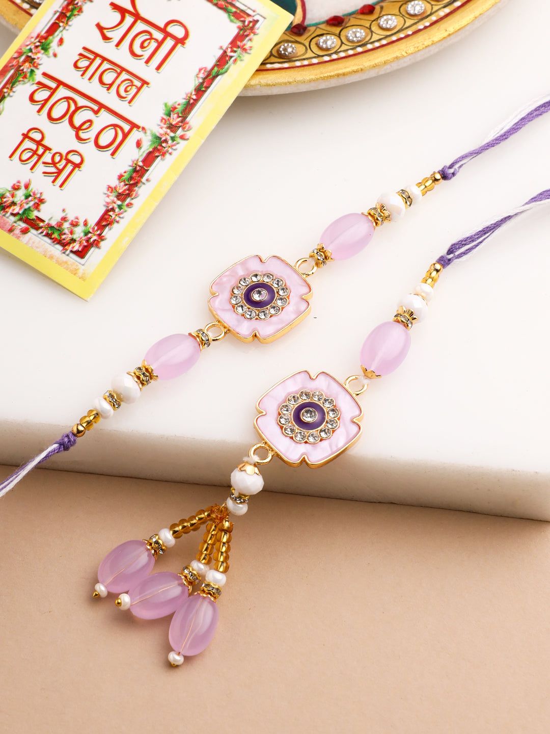 NVR Set of 2 Purple Artificial Stones & Beads Floral Design Thread Bhaiya Bhabhi Rakhi with Roli Chawal Chandan & Mishri-One Size / Purple