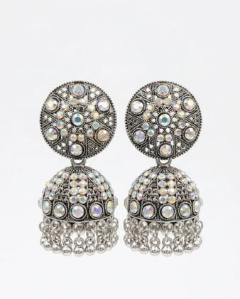 Vardaan Crystalx women's earing are stunning oxidized silver jhumkas feature intricate filigree tops sparkling with iridescent multicolored crystals, leading to classic dome bells adorned with shimmering stones and dangling chain tassels with tiny bells. Vardaan Crystalx women's earing are stunning oxidized silver jhumkas feature intricate filigree tops sparkling with iridescent multicolored crystals, leading to classic dome bells adorned with shimmering stones and dangling chain tassels with tiny bells.