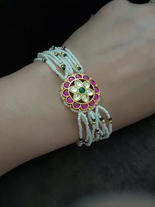 Flower design paachi kundan ruby, green and white cheed string bracelet