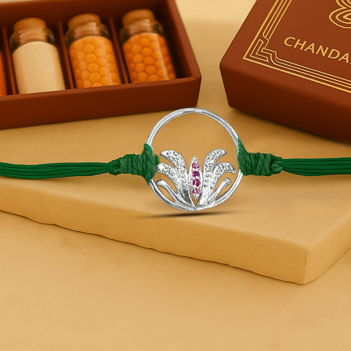 Pure 92.5 Lotus In Circle Silver Rakhi with Chandan Tilak Set