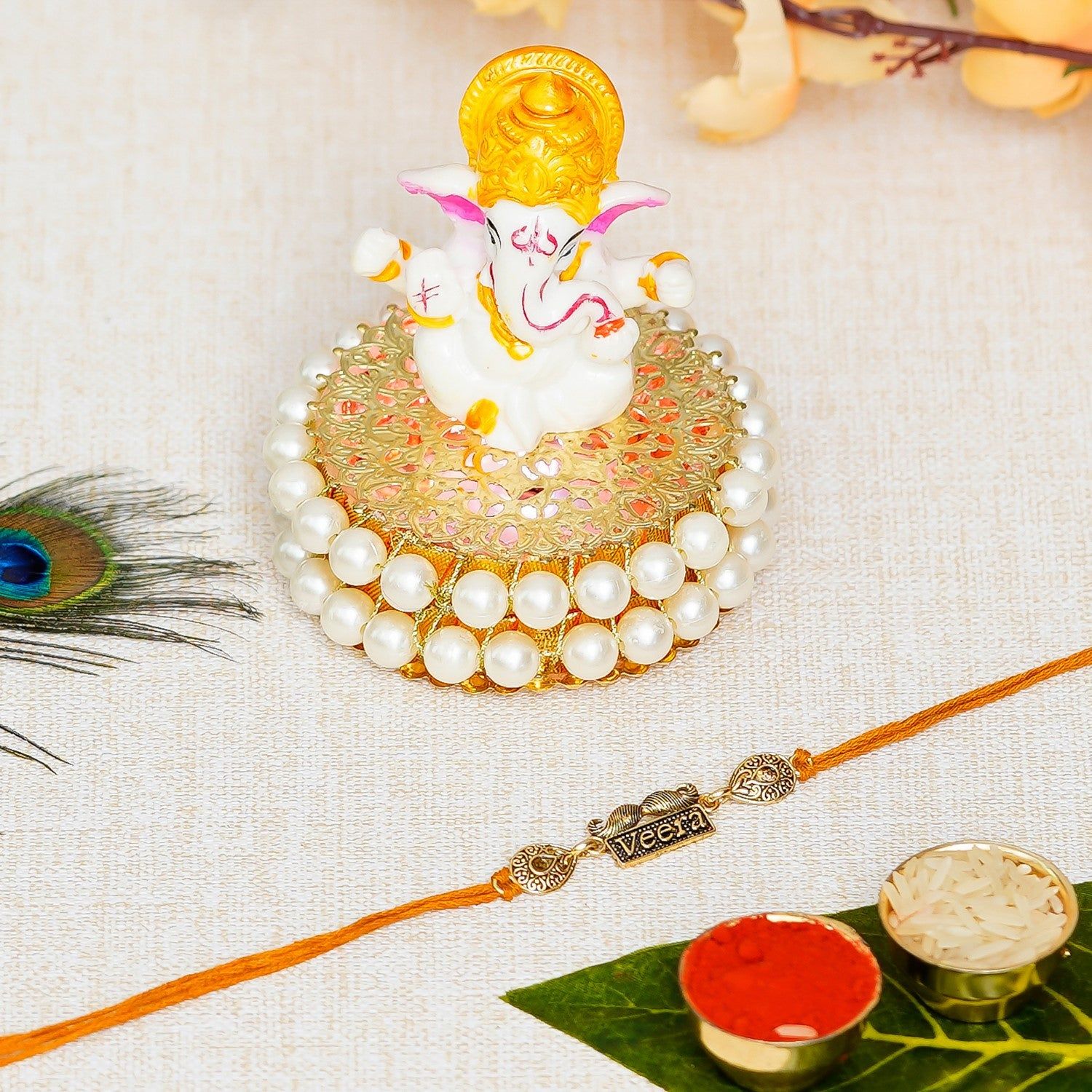 Designer Veera Rakhi with Lord Ganesha Idol on Decorative Handcrafted Plate for Home and Car and Roli Chawal Pack