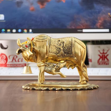 Dreamkraft Metal Om Kamdhenu Cow and Calf Statue Idol for Home Temple, Office & Tabletop Decoration Golden 12.5 cm Height Dreamkraft Metal Om Kamdhenu Cow and Calf Statue Idol for Home Temple, Office & Tabletop Decoration Golden 12.5 cm Height