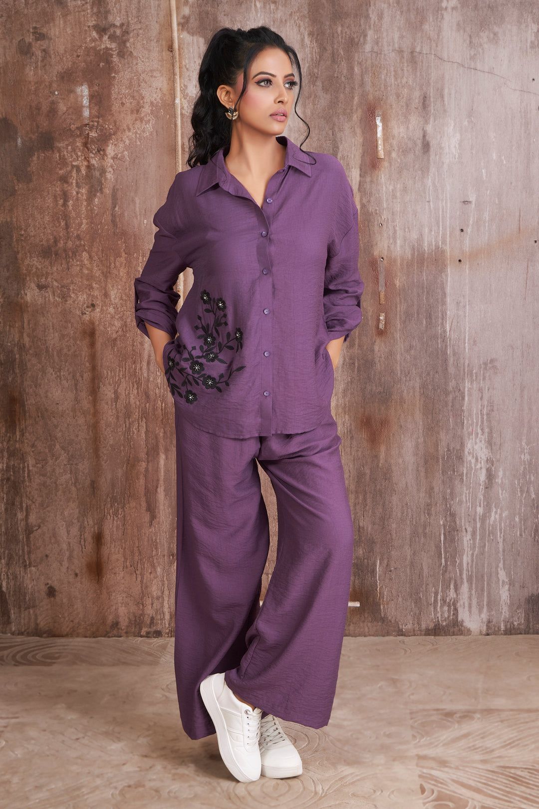Purple shirt with black thread and stone work in front and back teamed with palazzo pants-M