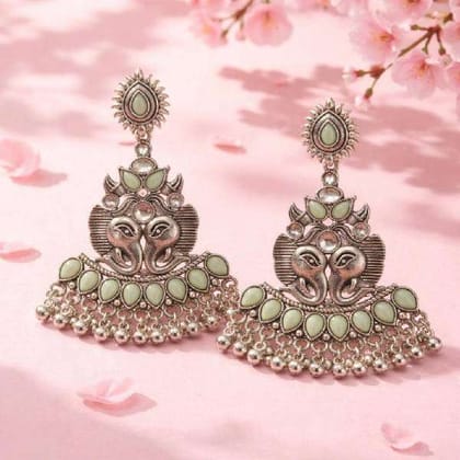 a traditional ornate design earing a traditional ornate design earing