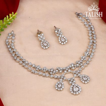 Elegant Silver-Plated Necklace Set with Teardrop and Floral American Diamond Stones