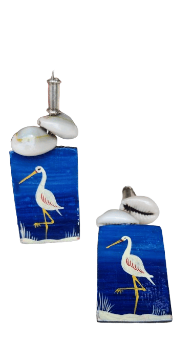 Hand painted wooden earrings featuring a blue heron design, made with sustainable materials.