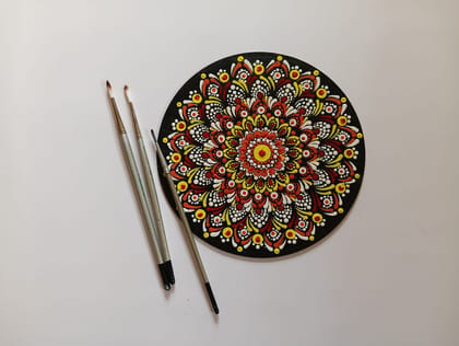 Hand-Painted Mandala Art on Black Background Hand-Painted Mandala Art on Black Background
