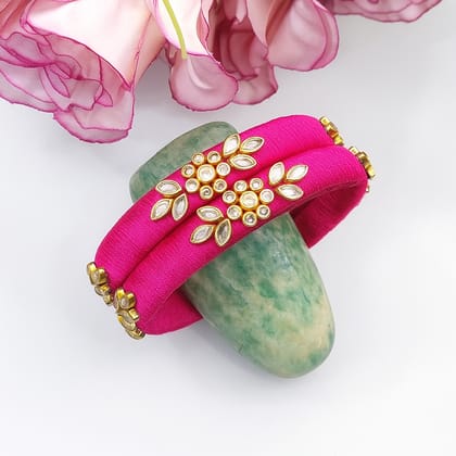 Fuchsia pink with gold and white accents- Floral Kundan motifs with intricate stonework Fuchsia pink with gold and white accents- Floral Kundan motifs with intricate stonework