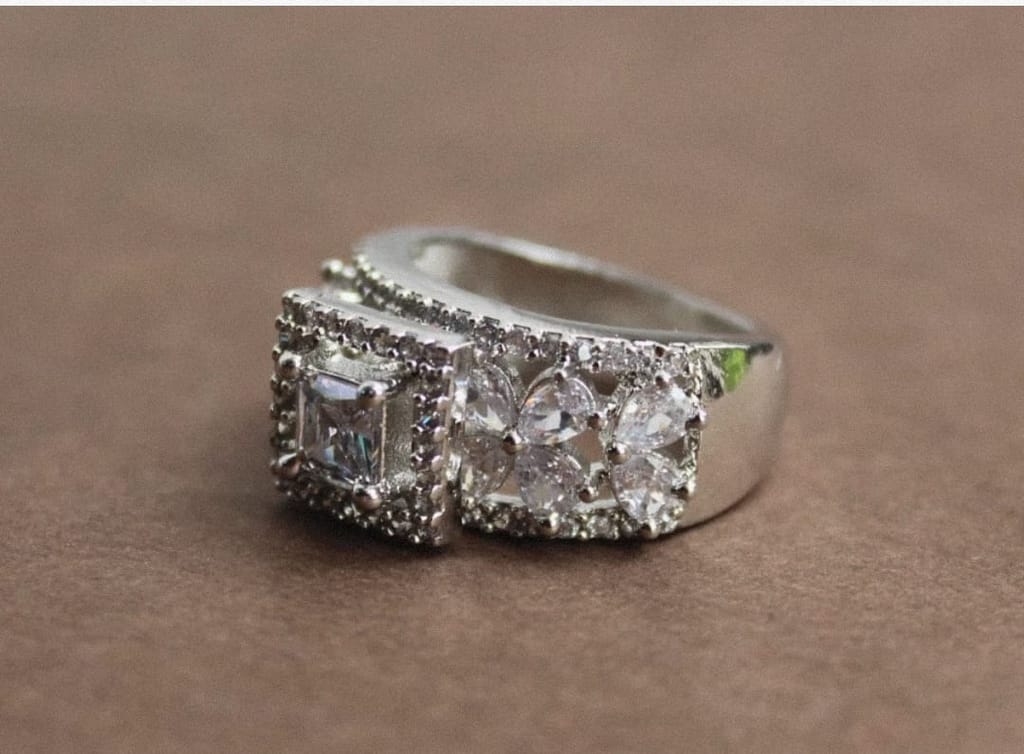 Elegant Sterling Silver Ring with Sparkling Gemstones