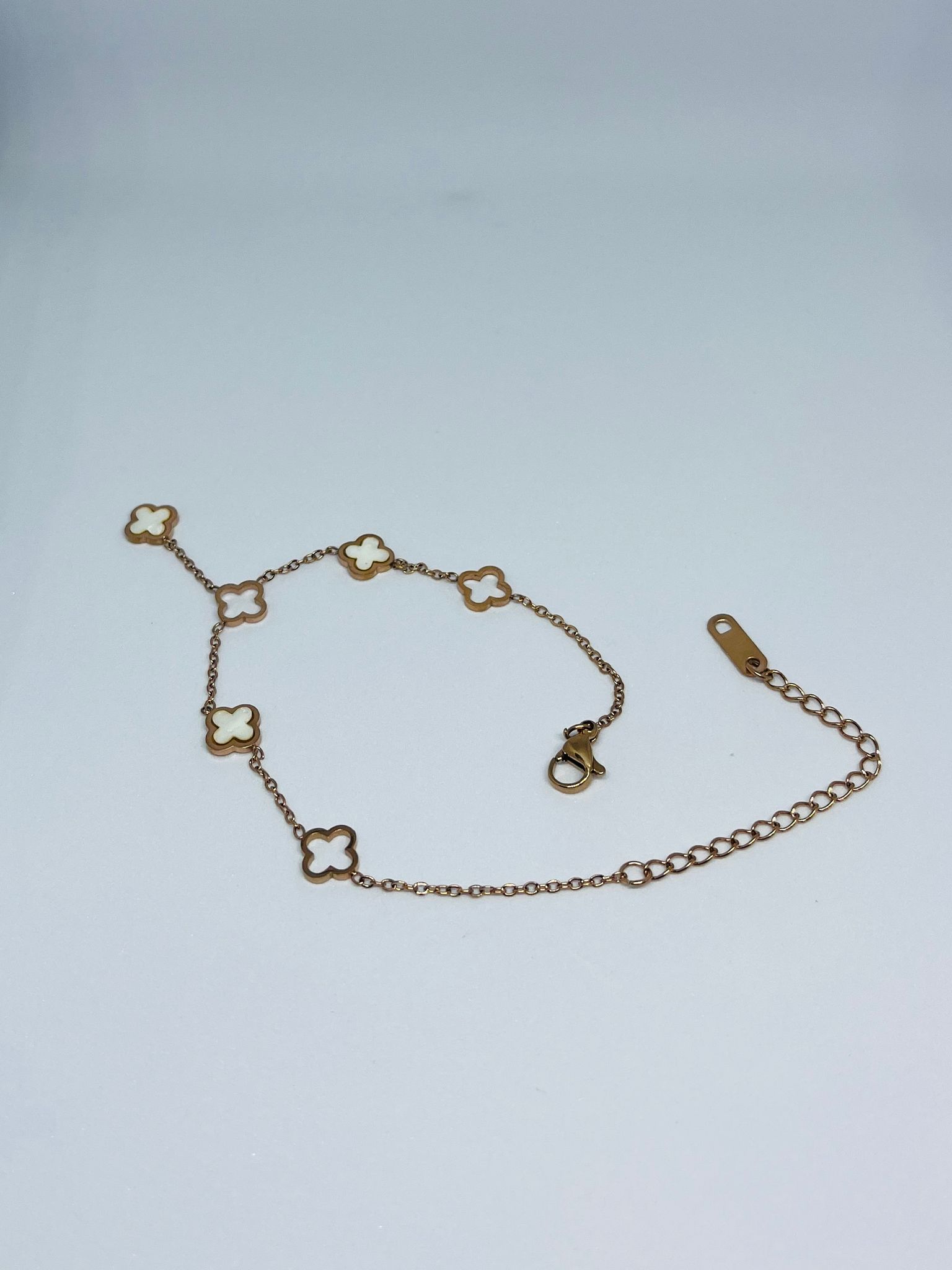 Elegant Gold-Toned Clover Charm Bracelet with White Inlay