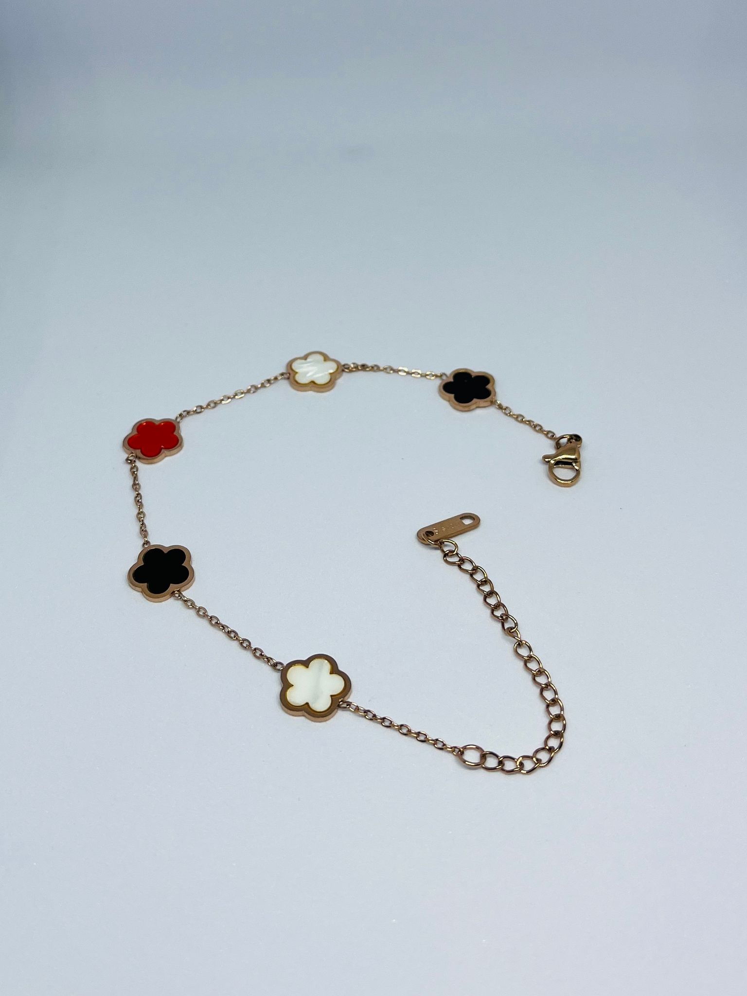 Gold Plated Clover Charm Bracelet with Red, Black & White Enamel Accents