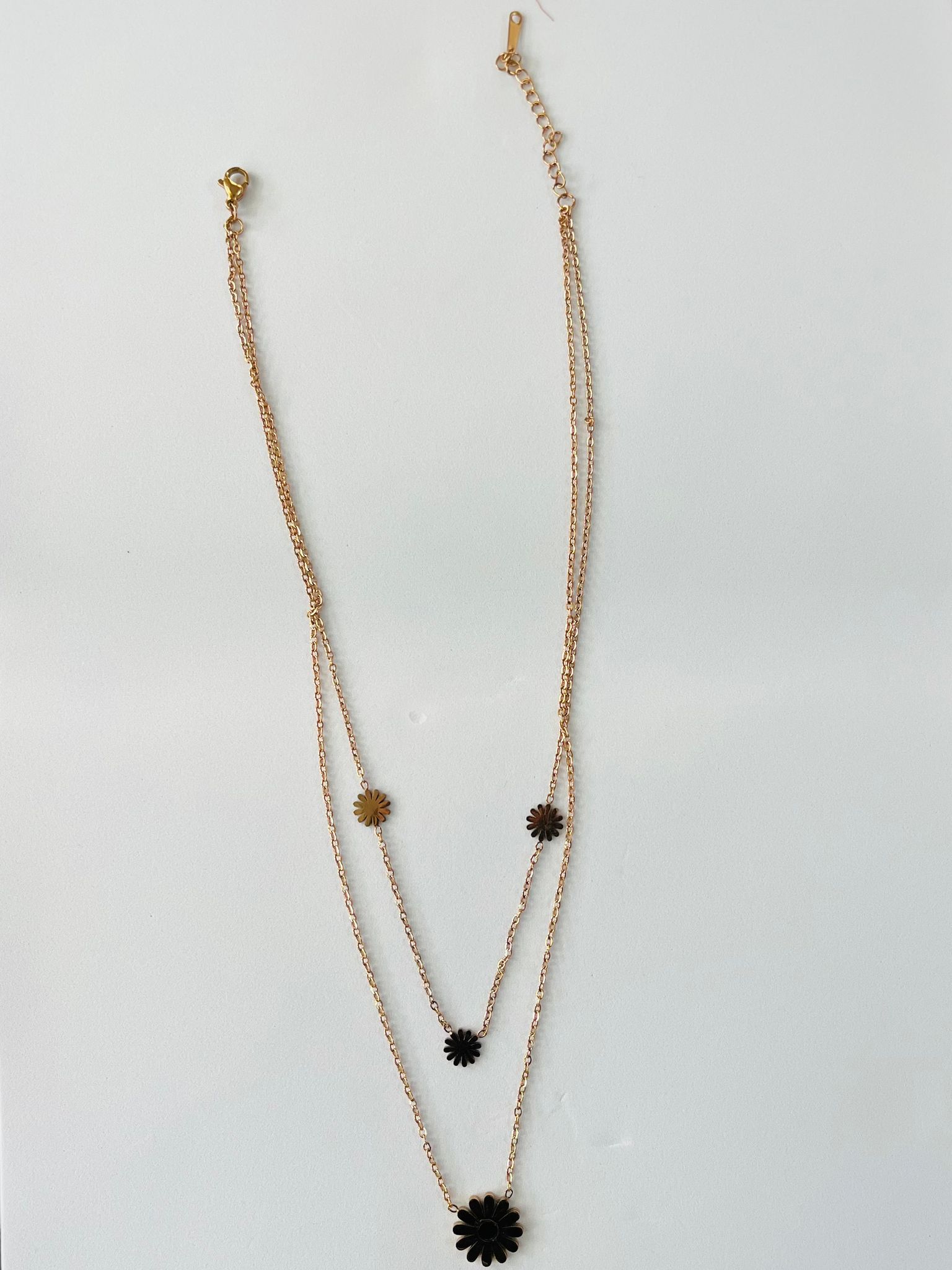 Layered Rose Gold Chain Necklace with Black Daisy Pendants