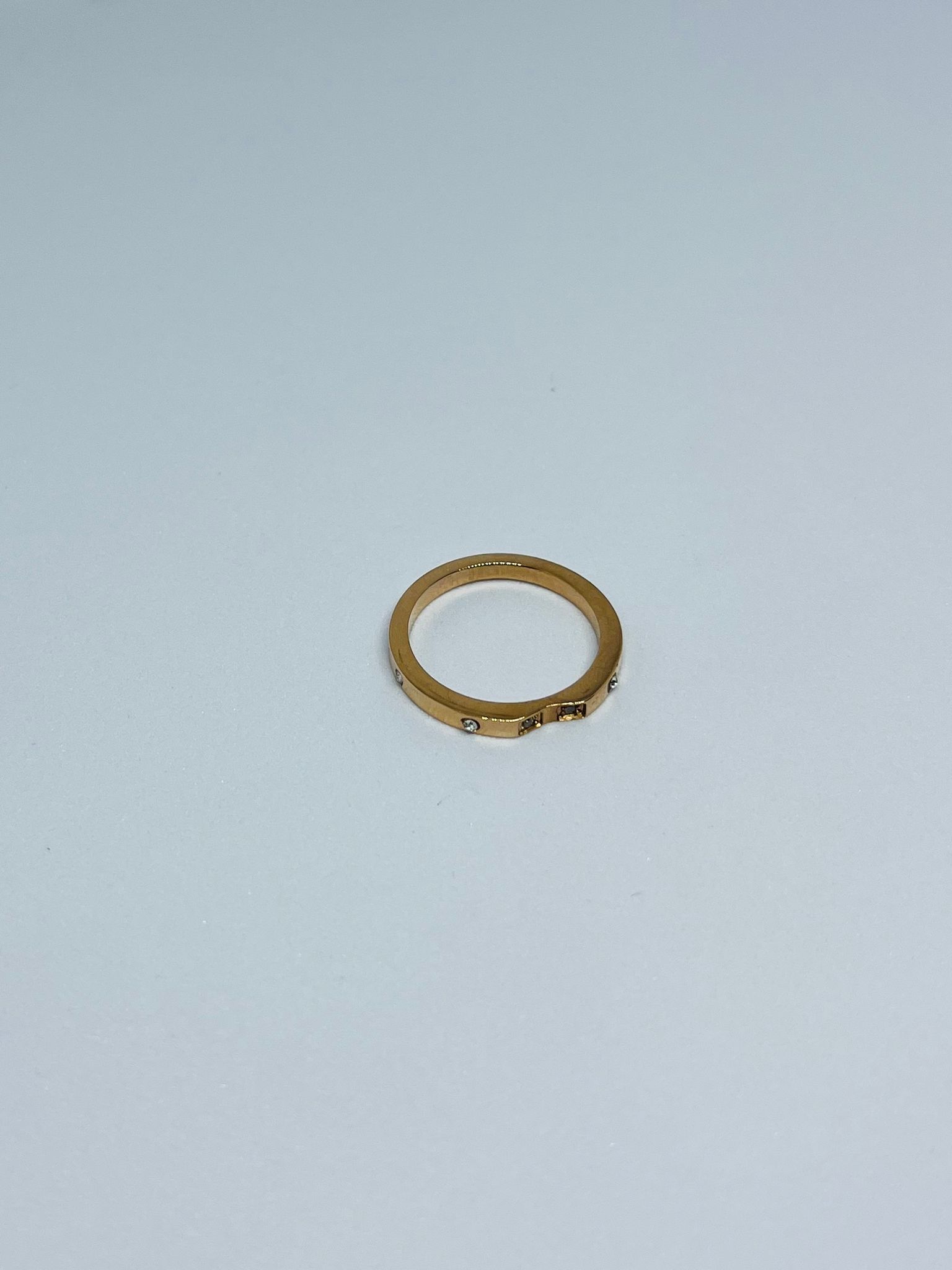 Elegant Gold-Tone Ring with Subtle Crystal Accents