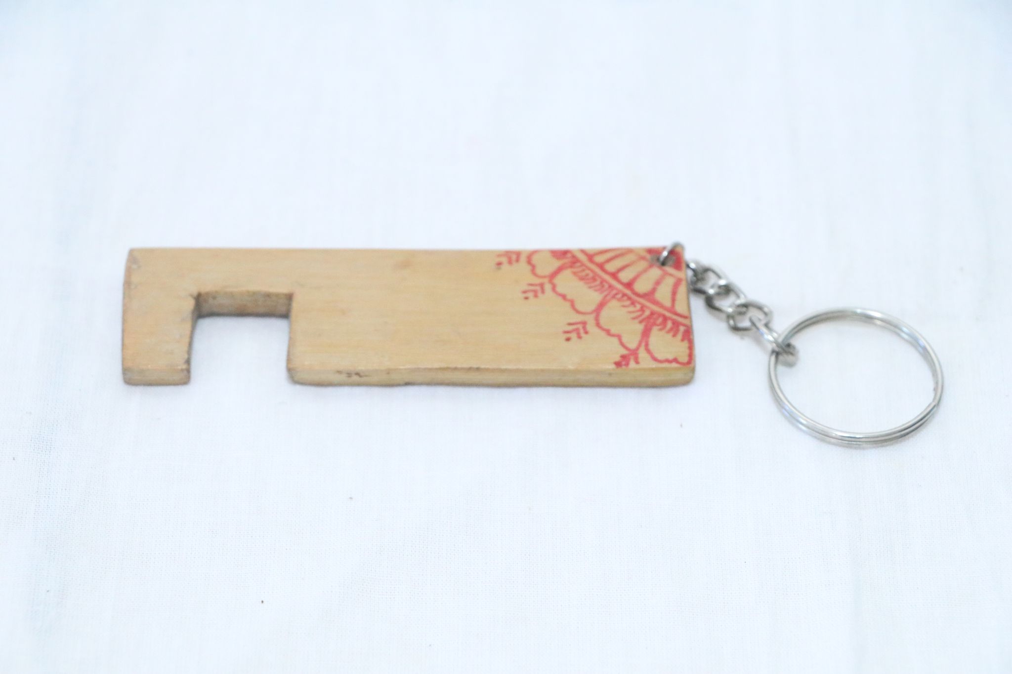 Artisan Wooden Keychain with Red Henna Design
