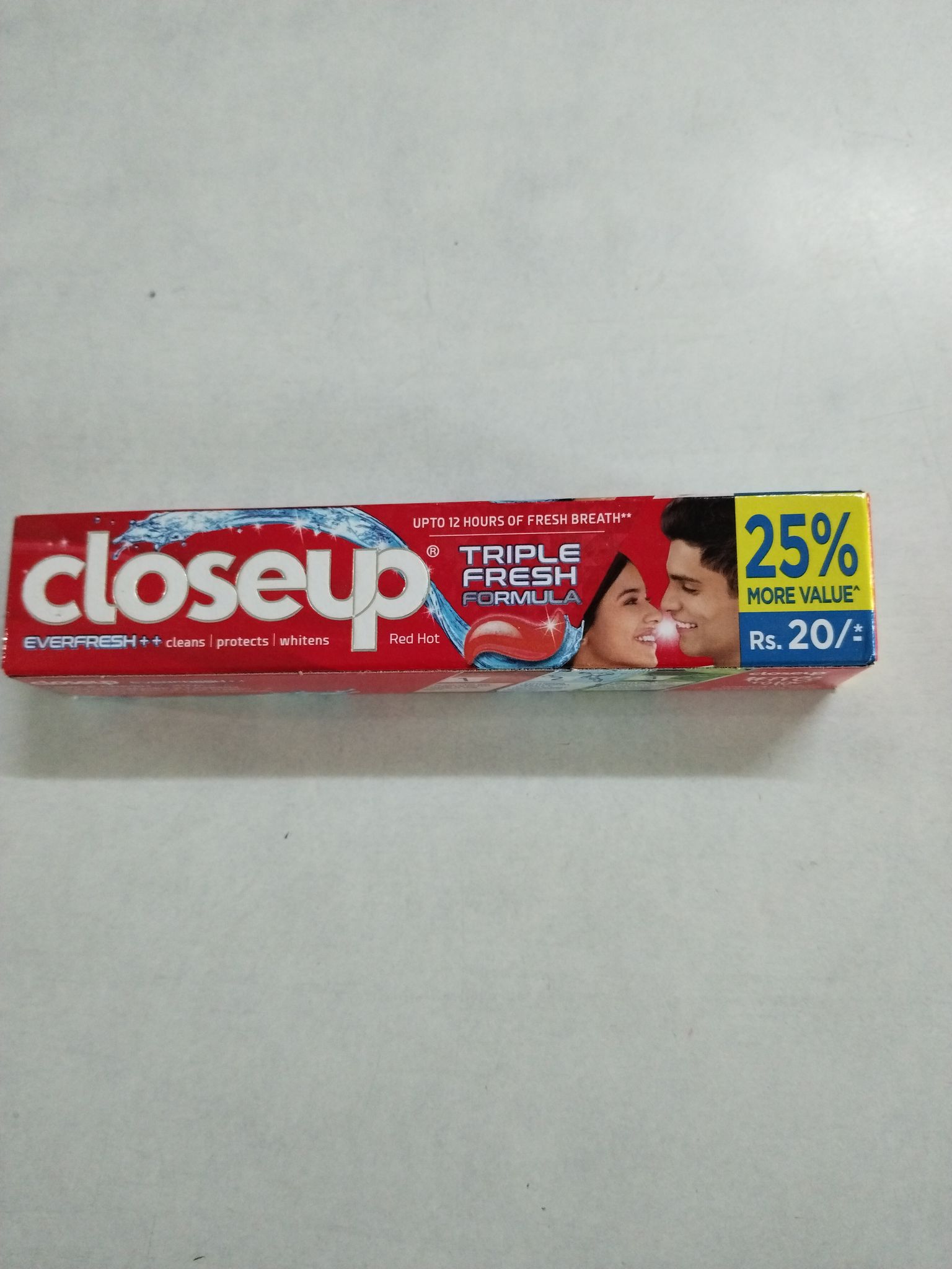 Closeup triple fresh toothpaste 