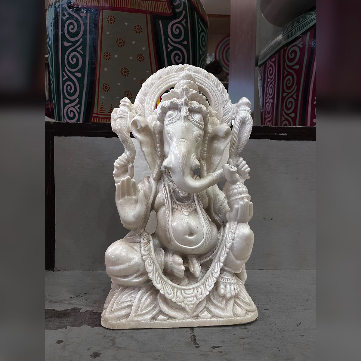 Lord Ganesha sitting marble stone statue