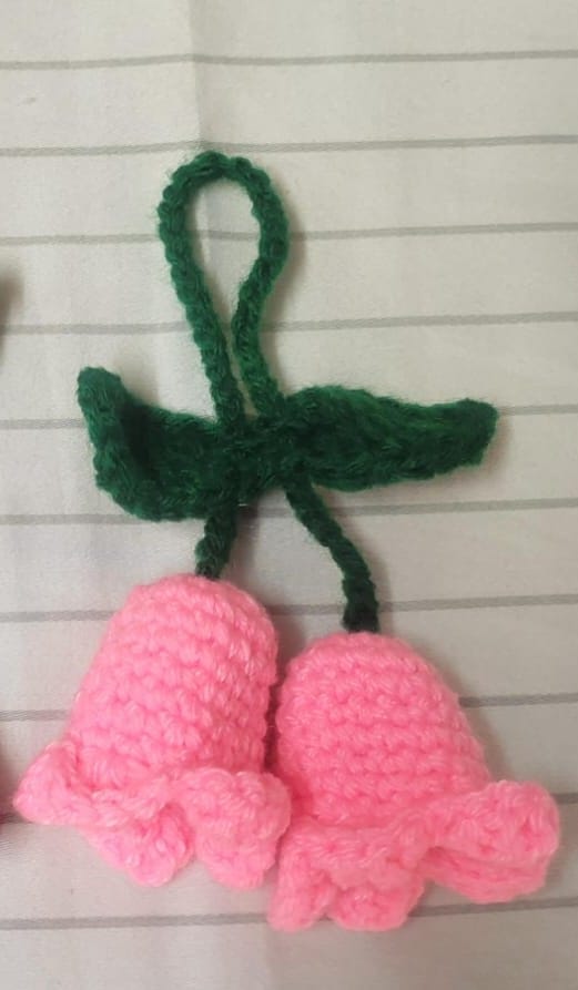 A lovely name for your crochet keychain could be “PinkBell Charm.” 🌸