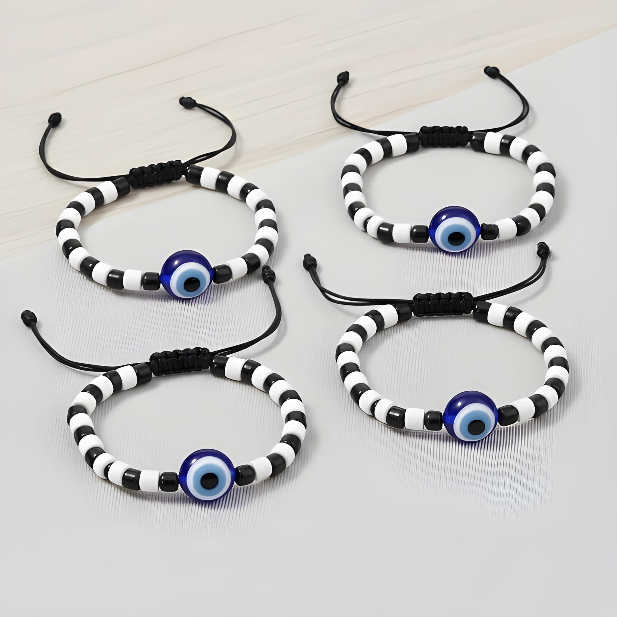 WUGO Baby Evil Eye Bracelet Nazariya – Pack of 4 | Cute Black Bead Nazar Protection Bracelets for Newborns, Infants & Kids | Adjustable Baby Wrist Accessory