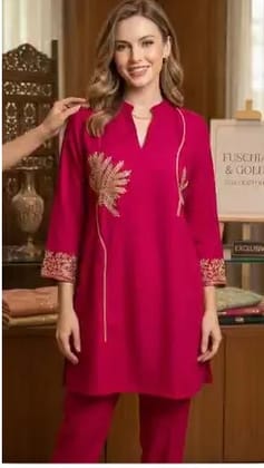 Premium rani pink suit with elegant golden embroidery.