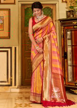 Roohi : Gold And Silver Zari Stripe Kanjivaram Saree In The Shades Of Pink And Yellow