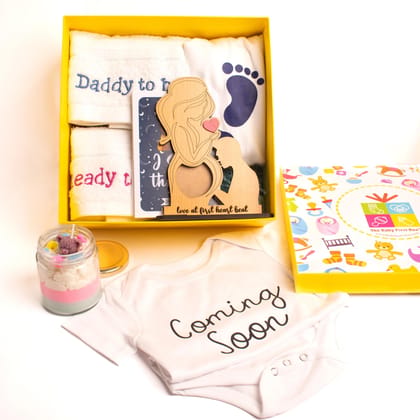 The Baby First Box Baby Shower Gift Hamper for Mom to Be -XXL Tshirt for Mom, Hand Towel for Mom & Dad, Baby Theme Candle, Love at First Sight Frame, Baby Romper(0-3 Months) in a Gift Box The Baby First Box Baby Shower Gift Hamper for Mom to Be -XXL Tshirt for Mom, Hand Towel for Mom & Dad, Baby Theme Candle, Love at First Sight Frame, Baby Romper(0-3 Months) in a Gift Box