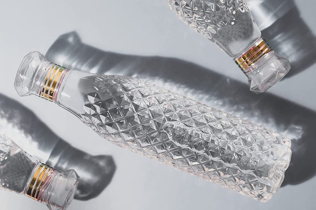 Set of 4 Space Saving Fridge Bottles with Caps, 1 Liter