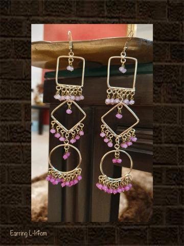 Long handmade earrings with three different beads of pink colour
