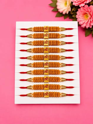 Celebrate Raksha Bandhan with this elegant set of 12 lotus design rakhis. Featuring pearl-like beads, yellow accents, and red-yellow threads for a festive traditional