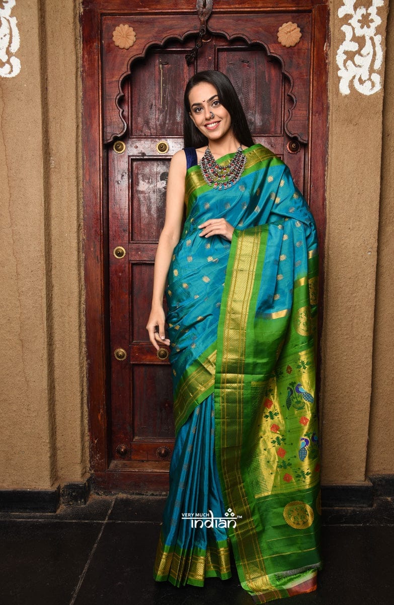 Rajsi~ Pure Silk Handloom Maharani Paithani in Turquoise Blue with a Vibrant Green & Golden Pallu.