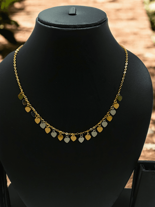 Gold Necklace Featuring a Heart Charm