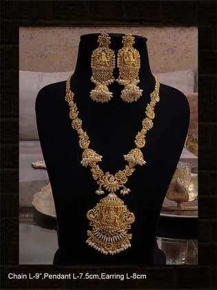 Polki,ruby,green and white stones studded ganpatiji pendant set with flowers and peacocks design
